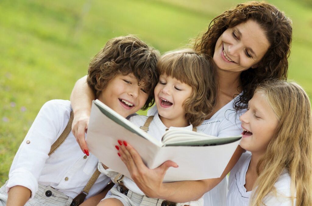 mom reading to 3 chilcren