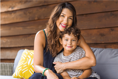 Mom and child smiling at home