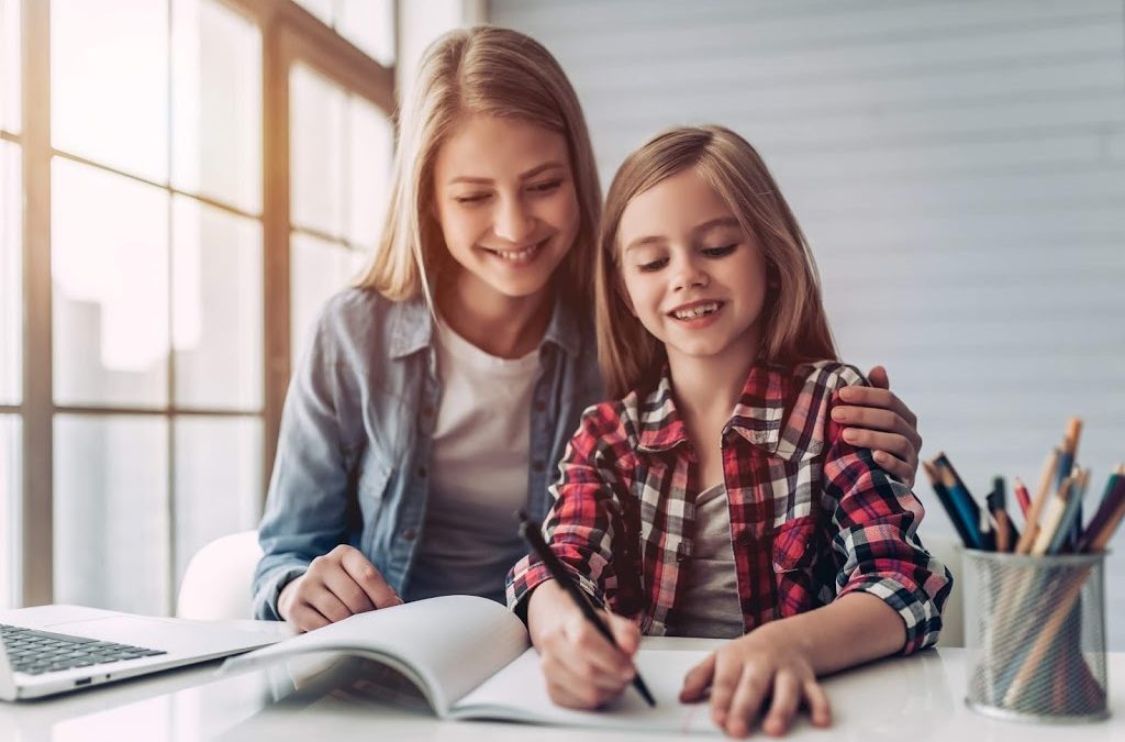 homeschool teen with little sister with big smiles
